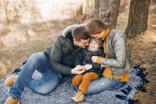 Free photo cute family playing in a summer park