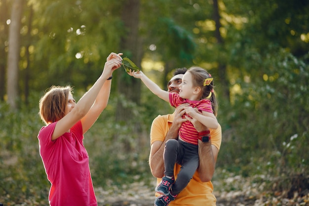 Cute family playing in a summer park