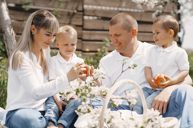 Free photo cute family playing in a summer yard