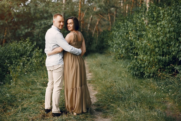 Cute family spending time in a summer field