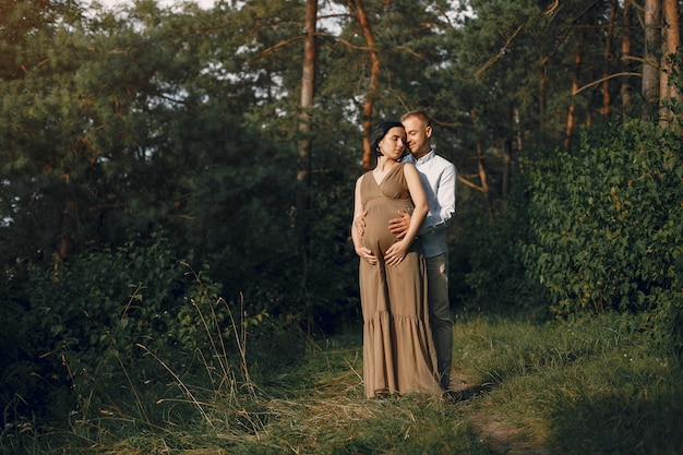 Cute family spending time in a summer field