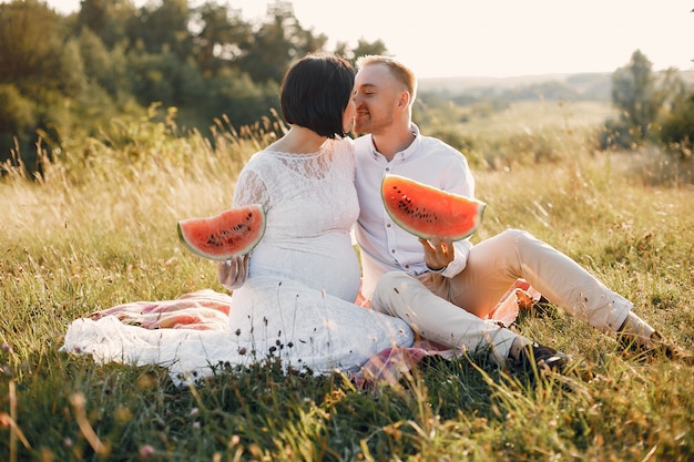 Cute family spending time in a summer field