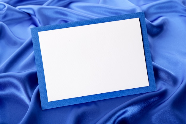 Free photo cute frame on blue silk