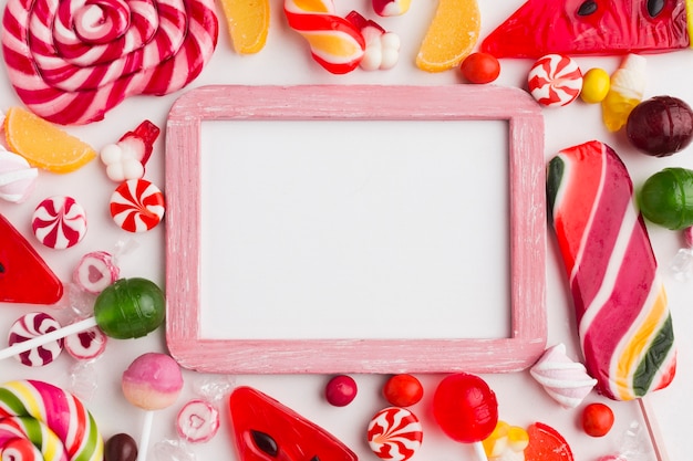 Cute frame with sweets and copy space