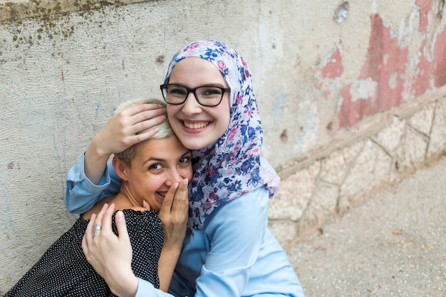 Cute friends sharing a hug