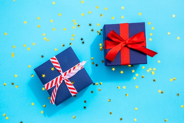Cute gifts with sparkles on blue background