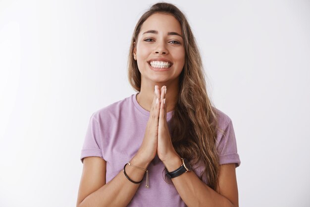 cute girl asking favour with praying hands gesture