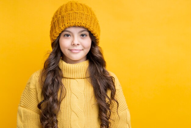 Cute girl dressed in thick clothes