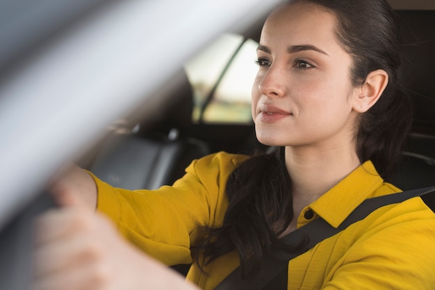 Free photo cute girl driving her car