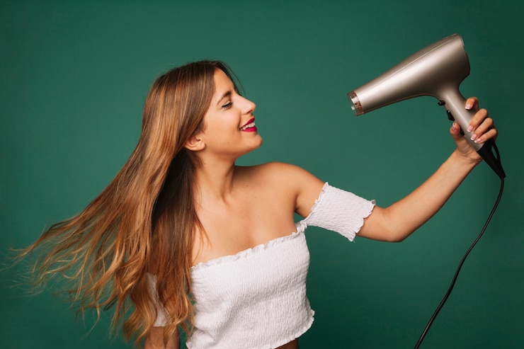 Free Photo cute girl drying her hair