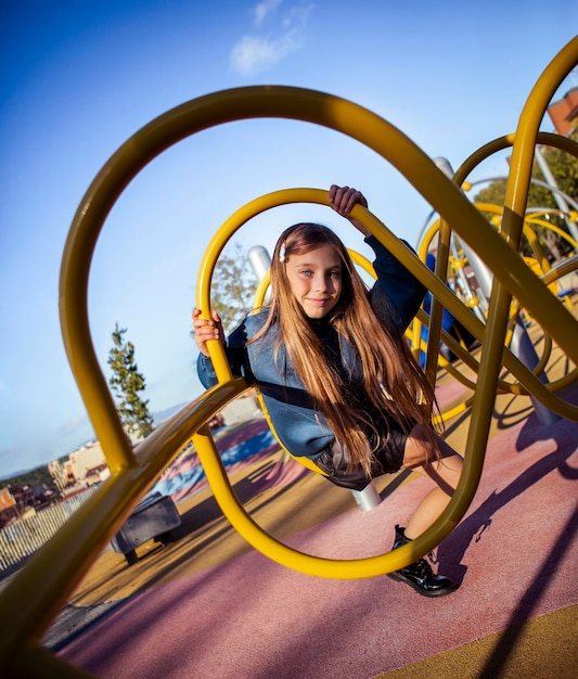 Free photo cute girl having fun at the playground