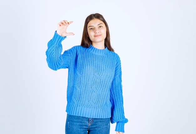 cute girl holding open space on white.