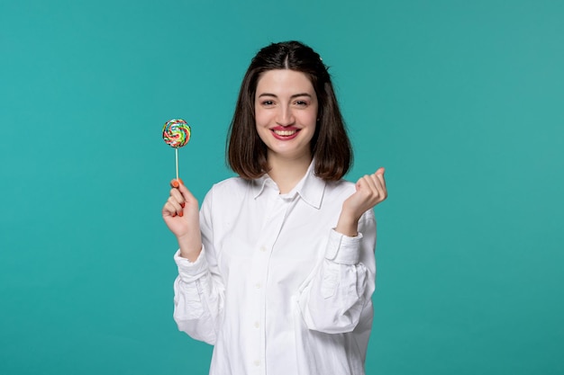 Cute girl pretty brunette young sweet girl in white shirt holding fists super excited