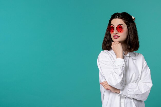 Cute girl pretty brunette young sweet girl in white shirt looking far in red glasses