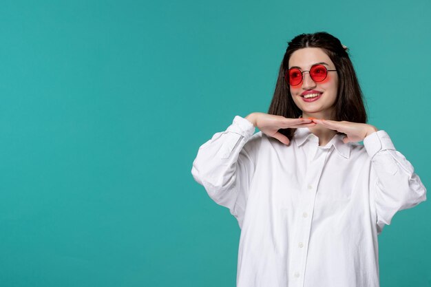 Cute girl pretty brunette young sweet girl in white shirt putting hands under chin cute