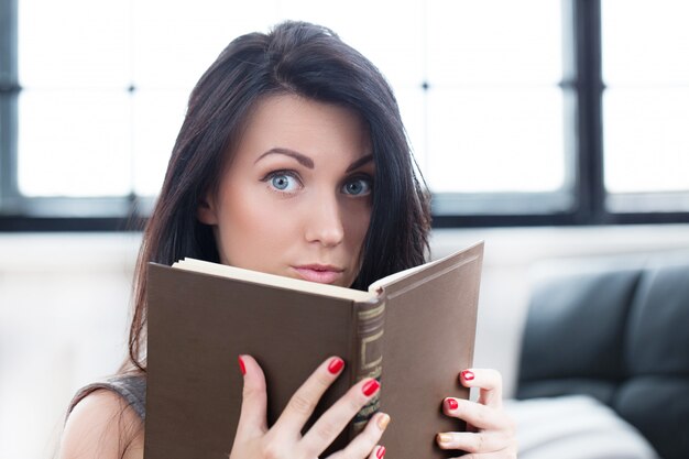 Cute girl reading a book