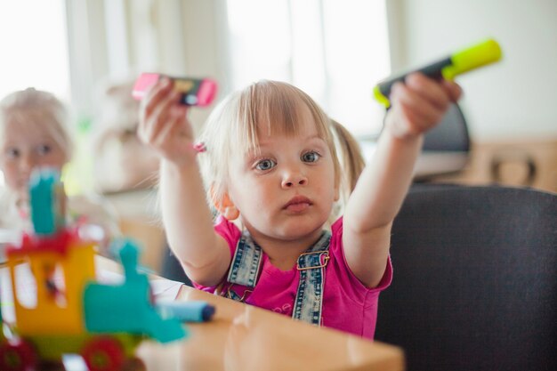 Cute girl showing markers