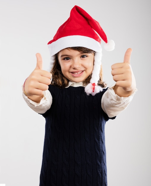 Cute girl showing thumbs up