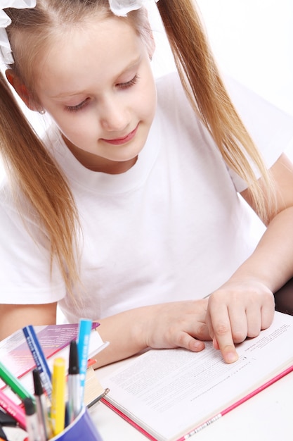 Cute girl sitting at the desk