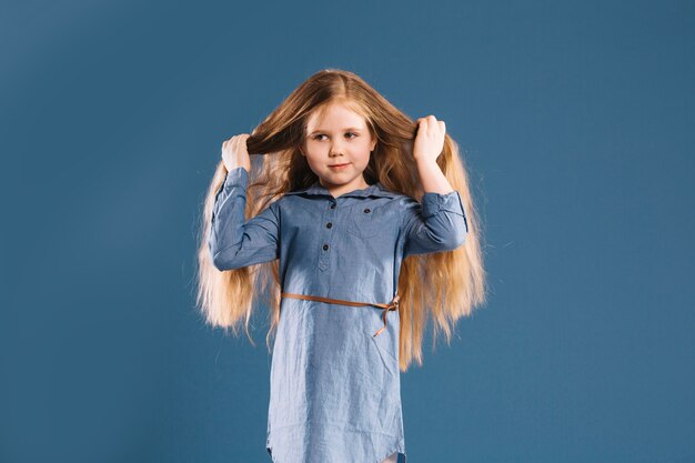 Cute girl touching hair