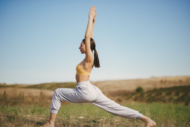 Cute girl training in a field