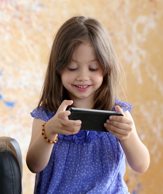 Cute girl using smartphone