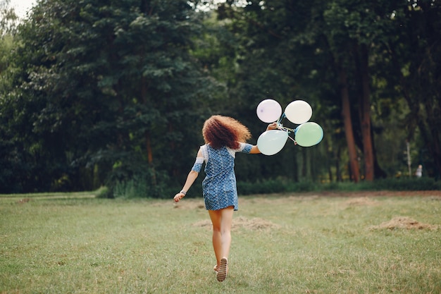 Cute girl walking in a summer park