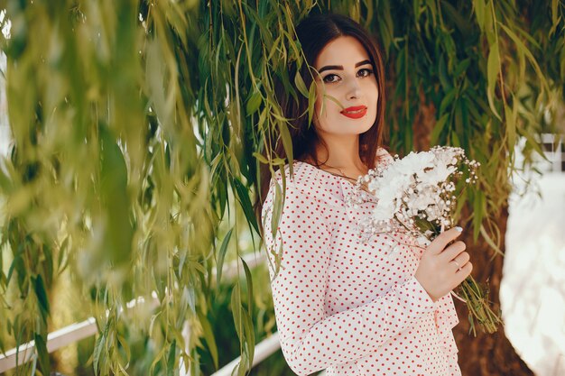 Cute girl walking in a summer park