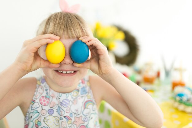 Cute girl with Easter eggs