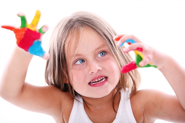 Free photo cute girl with paint stained hands