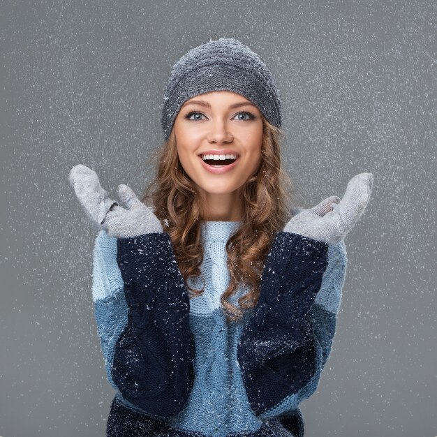 Cute girl with snowflakes having a good time