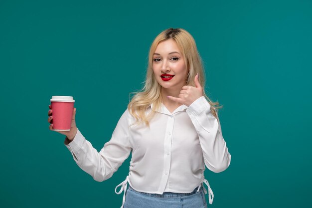 Cute girl young adorable pretty girl in a white neat shirt with pink coffee cup calling someone