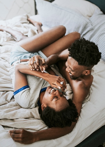 couple playing in bed