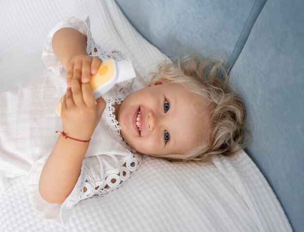 Cute happy child in bed