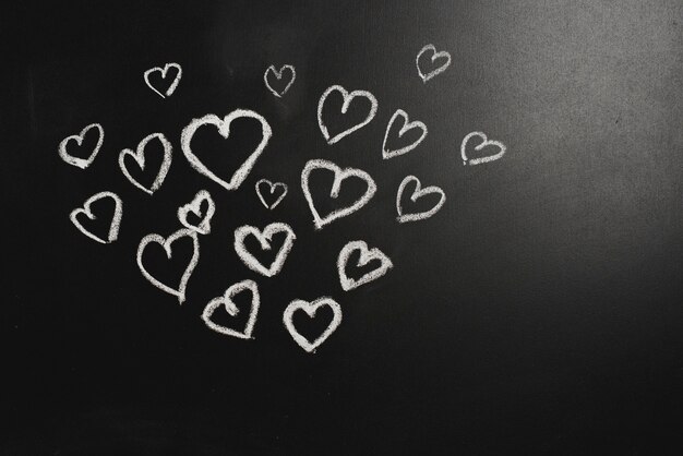 Cute hearts on blackboard