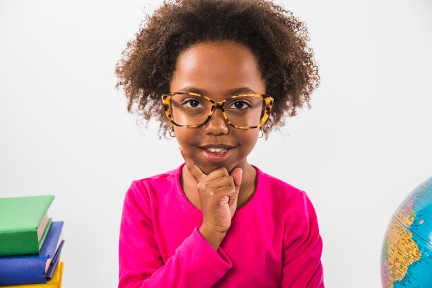 Cute kid in glasses in studio