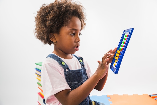 Cute kid with abacus in studio 