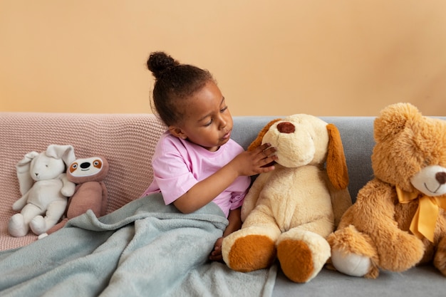 Free photo cute kid with stuffed animal