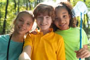 Free photo cute kids exploring nature