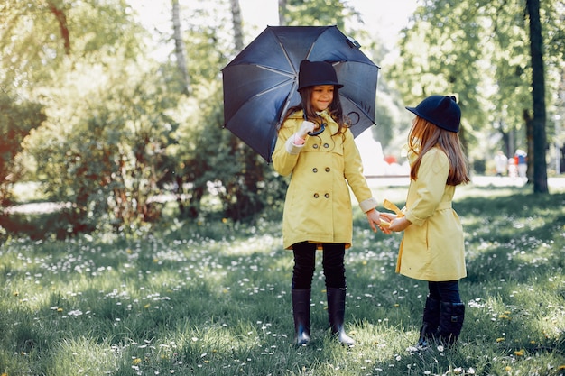 Cute kids plaiyng on a rainy day