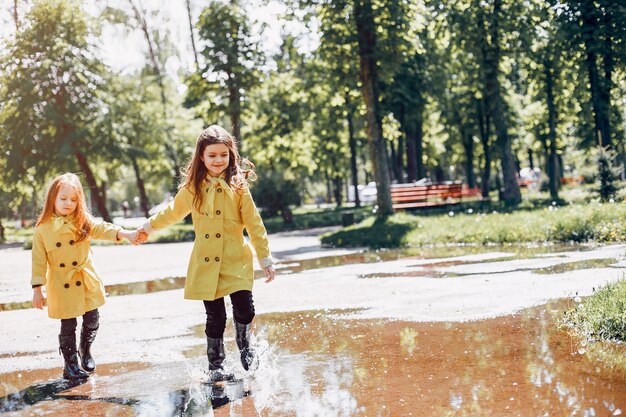 Cute kids plaiyng on a rainy day