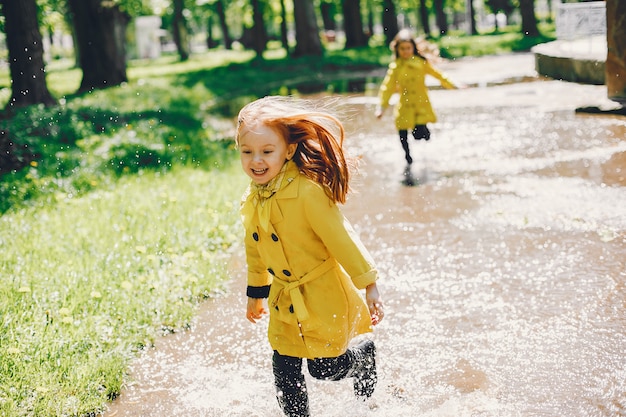 Cute kids plaiyng on a rainy day