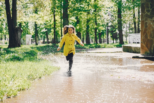 Cute kids plaiyng on a rainy day