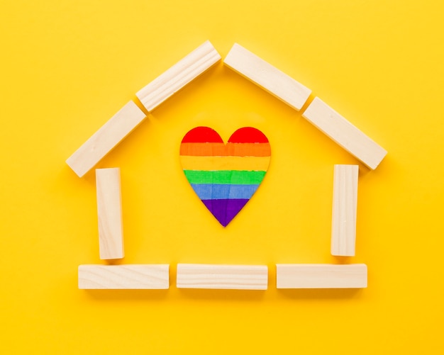 Cute lgbt family concept arrangement on yellow background