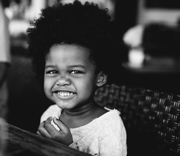 Free photo cute little african boy at a resort