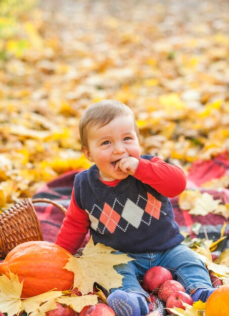 Cute little baby with pumpkin laughing