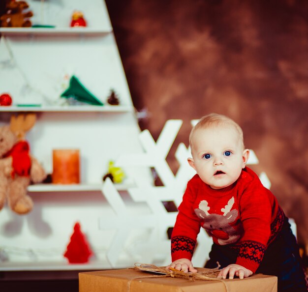 Cute little boy laughing in  New Year  studio