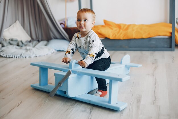 Cute little boy playing at home