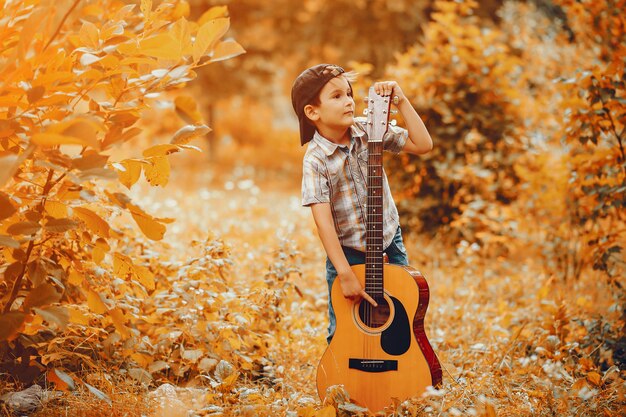 Free photo cute little boy playing in a park