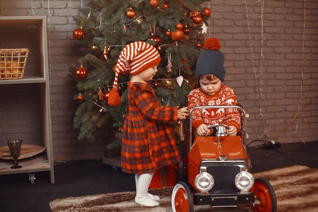 Free photo cute little boy in a red sweater.